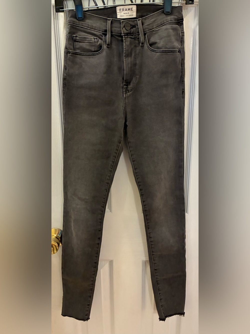 Frame Denim Skinny Jeans in Washed Black with Ankle Slit Detail